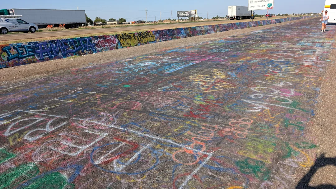Graffiti on the frontage road and K-rails near Cadillac Ranch